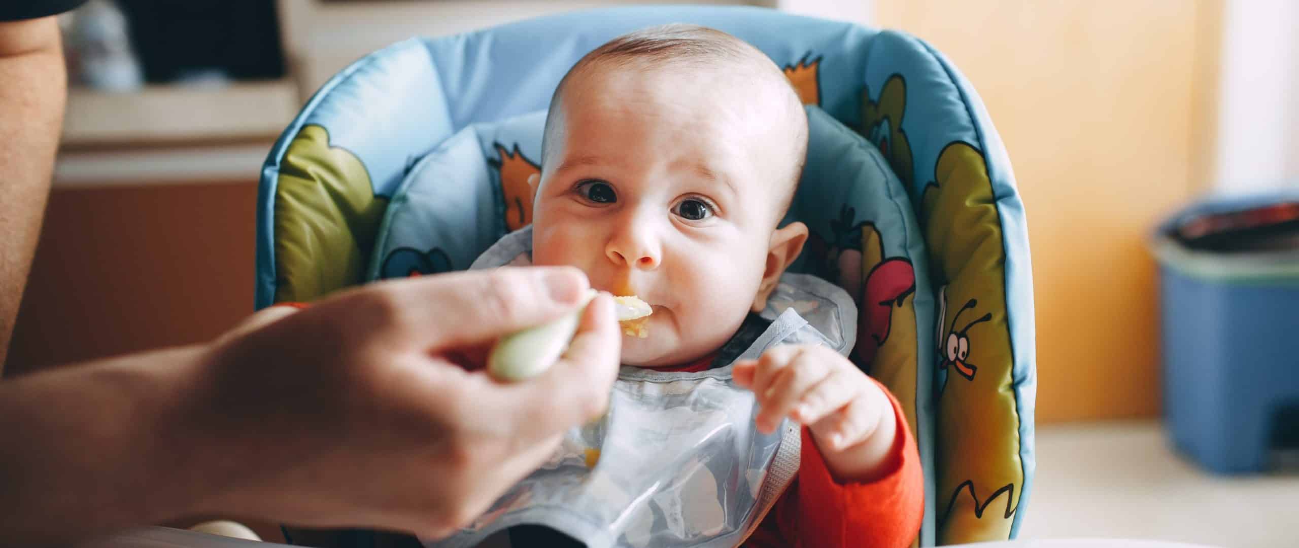 baby eating with spoon