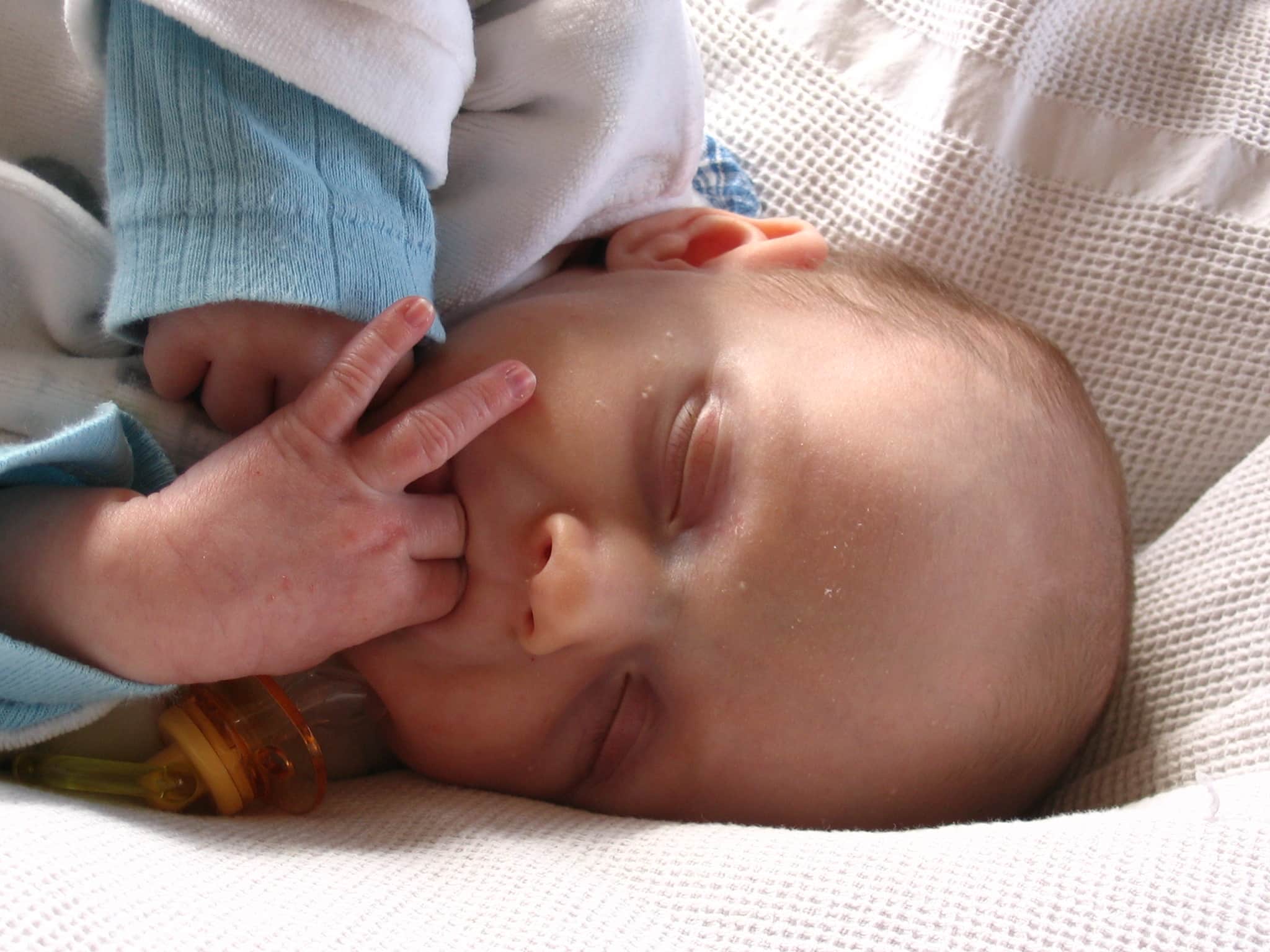 3 month old store baby biting hands